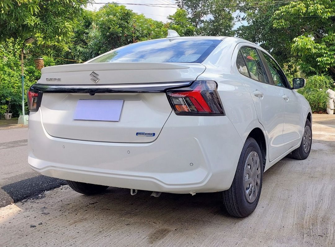 Suzuki Swift 1.2 (A) (Category: Used Cars) located in Caloocan City. Submitted by wisewhale.acb117 (Listing ID 1463972699, Image 3). Description: Bring home our good as new 2026 SUZUKI DZIRE SMART HYBRID GL 1.2 CVT. (Formerly Suzuki Swift Dzire) • Mileage: Only 374 KM • Pristine condition, factory plastics intact • Color: Neat & Sleek Arctic White Pearl Metallic VEHICLE HIGHLIGHTS: • 7" Touchscreen w/ Apple CarPlay & Android Auto • Cruise Control