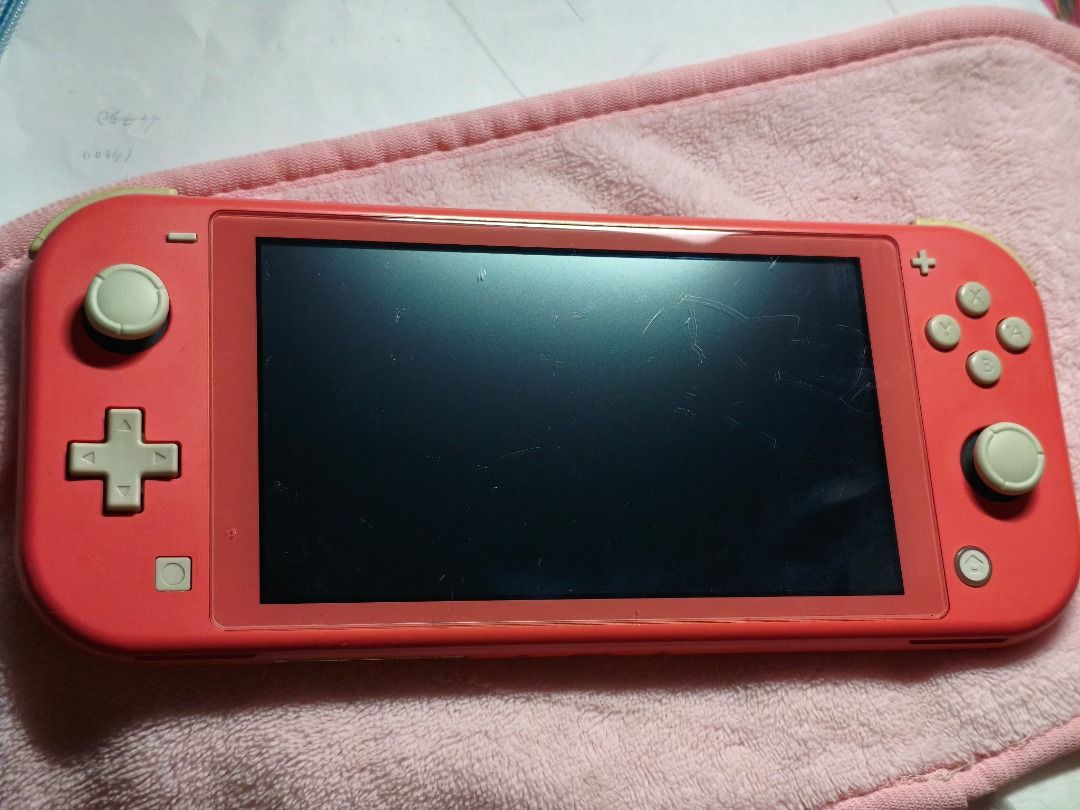 Nintendo Switch Lite Coral Pink (Category: Nintendo) located in Caloocan City. Submitted by ae-soups (Listing ID 1464000715, Image 1). Description: selling switch lite coral pink unit only • bought it as 2nd hand • visible scratches on the screen • yellowish side buttons selling for 4200 rfs: will buy a newer unit crossposted on fb.