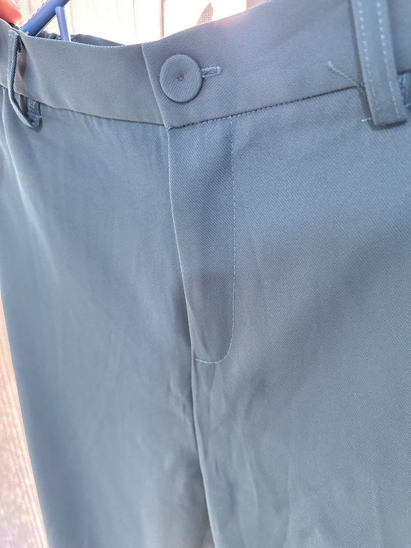 Teal Formal Trousers (Category: Trousers) located in General Trias. Submitted by keiperry_ (Listing ID 1463947562, Image 3). Description: - Teal colored formal trousers - Size XL best fit to Large - Button and zip closure at the front - Belt loops for accessories - Classic straight leg cut - Versatile for work or smart casual events - Comfortable polyester blend material.