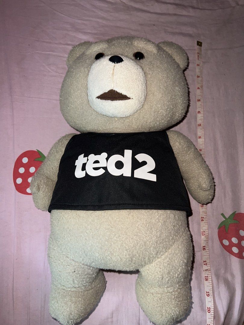 Ted 2 Teddy Bear Plush Toy (Category: Plushies & Soft Toys) located in Bulacan. Submitted by haven_plushie_dolls.888 (Listing ID 1464114748, Image 1). Description: - Ted 2 teddy bear plush - Approximately 18 inches tall - Includes black tank top with 'ted2' print - Brand new with tag still attached - Ideal for fans of the Ted movies.
