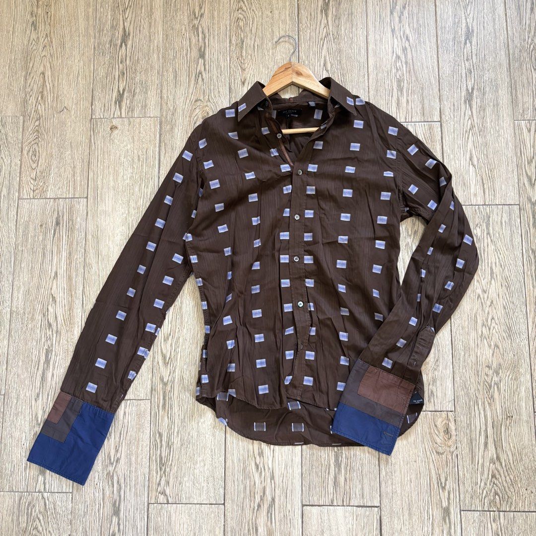 Ted Baker Brown Long Sleeve Polo Buttondown (Category: Formal Shirts) located in Imus. Submitted by reloved.nd (Listing ID 1464073302, Image 1). Description: - Brand: Ted Baker - Color: Brown - Sleeve Length: Long Sleeve - Pattern: Subtle light blue square pattern - Details: Contrasting patches on cuffs - Closure: Button-up front - Occasion: Smart casual.