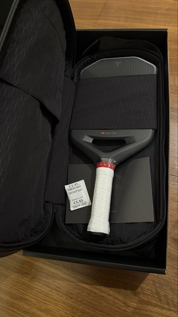 Tesla Pickleball Paddle with Case (Category: Racket and Ball Sports) located in Paranaque City. Submitted by dyan.mnl (Listing ID 1464076638, Image 2). Description: - Tesla plaid pickleball paddle by Selkirk - Includes protective case and box - White tape on grip - Suitable for all player levels - Ready for the court.