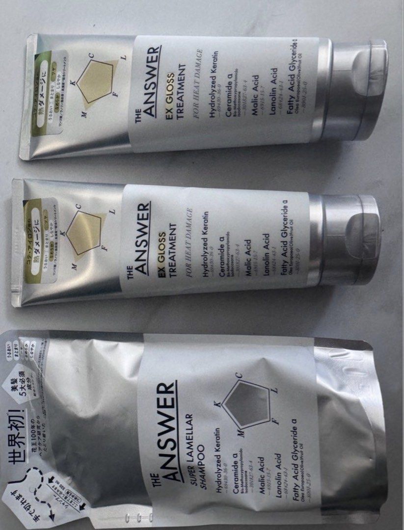 The Answer EX Gloss Treatment & Super Lamellar Shampoo (Category: Hair) located in Manila. Submitted by decluterthings888 (Listing ID 1464030811, Image 1). Description: - The Answer EX Gloss Treatment for severe heat damage repair. - The Answer Super Lamellar Shampoo refill pouch included. - Both products focus on hair repair and enhancing shine. - Key ingredients: Hydrolyzed Keratin, Ceramide, Malic Acid, Lanolin Acid, Fatty Acid Glyceride. - Id