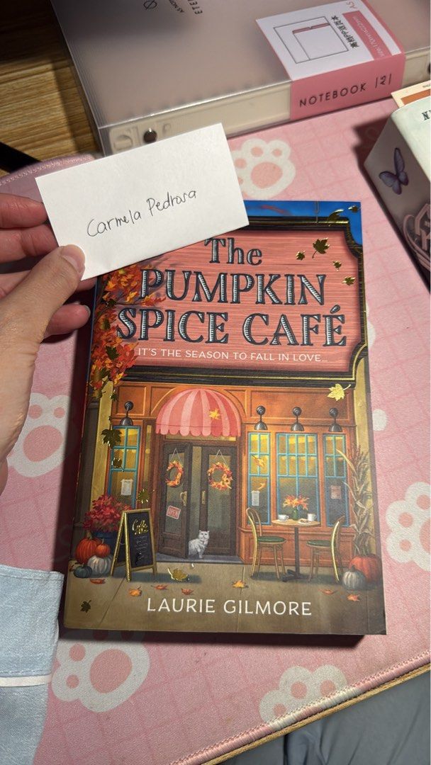The Pumpkin Spice Cafe by Laurie Gilmore (Category: Storybooks) located in Caloocan City. Submitted by pedrosacar55772 (Listing ID 1464106956, Image 1). Description: - Very like new condi - RFS: Extra copy - Sweet small-town romance story - Features Jeanie, who inherits a cafe - Jeanie finds love with local farmer Logan - A perfect read for the autumn season.