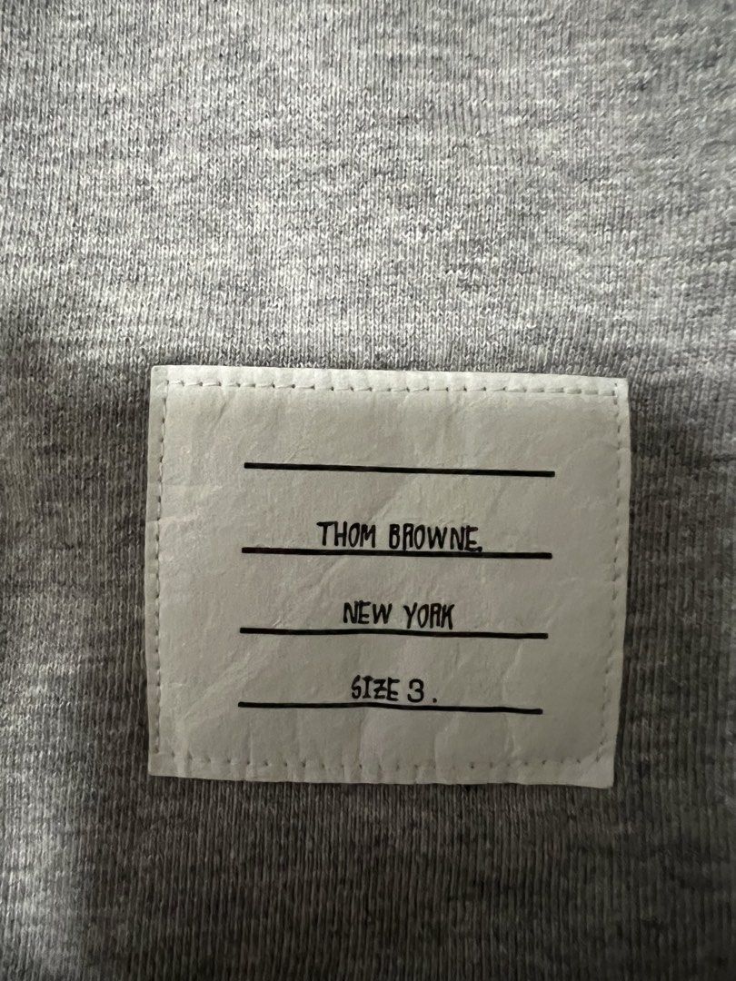 Thom Browne Grey Zip-Up Hoodie Size 3 (Category: Hoodies) located in Manila. Submitted by justin_sy (Listing ID 1463982647, Image 2). Description: - Grey Thom Browne zip-up hoodie - Signature four-stripe detail on sleeve - Made in Japan - Size 3 - Silver-tone zipper.