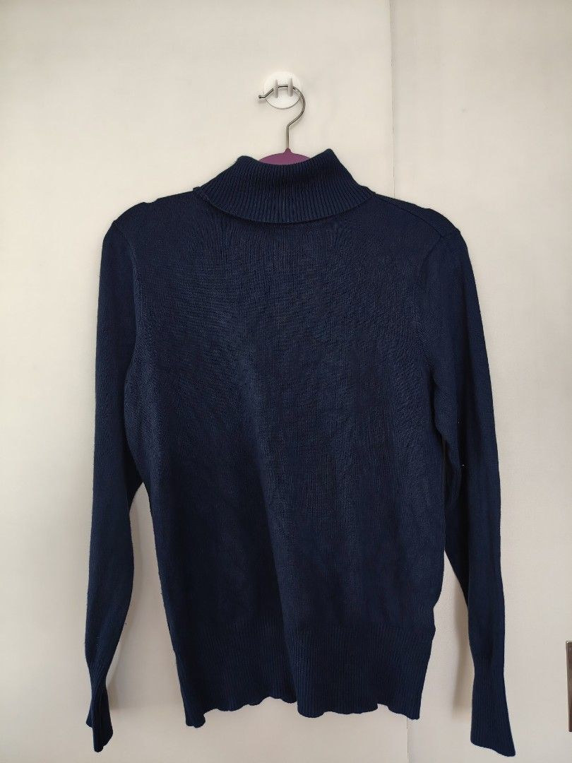 Time and Thru Navy Blue Turtleneck Sweater (Category: Coats, Jackets and Outerwear) located in Manila. Submitted by babeboxtheory (Listing ID 1463982182, Image 2). Description: - Classic navy blue turtleneck sweater - Soft, comfortable knit material - Long sleeves with ribbed cuffs and hem - Versatile for dressing up or down - Ideal for layering in cooler weather - Easily pairs with skirts or trousers.