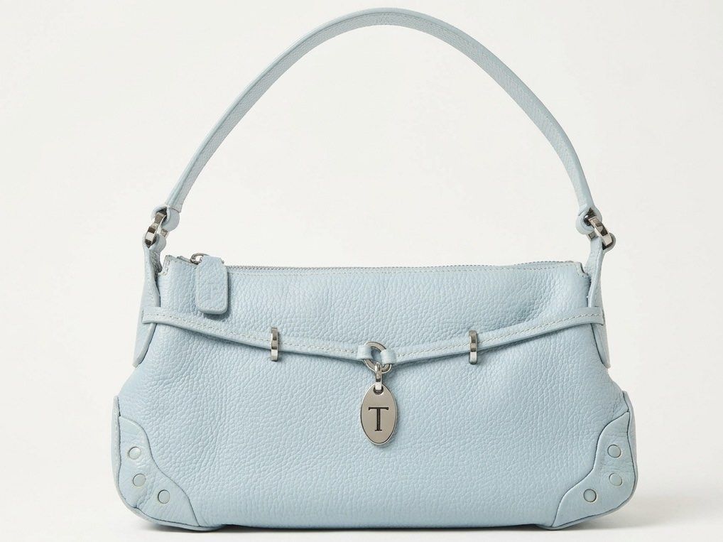 Tod's Light Blue Leather Shoulder Bag (Category: Shoulder Bags) located in Quezon City. Submitted by kaye_mm (Listing ID 1463955122, Image 1). Description: ✨ Description & Details Up for sale is a stunning, authentic vintage Tod’s Belted Shoulder Bag crafted from premium, butter-soft grained calfskin leather in a gorgeous sky blue hue. This iconic bag features contrast cream topstitching, signature silver-tone hardware, and a prominent metal “T” 