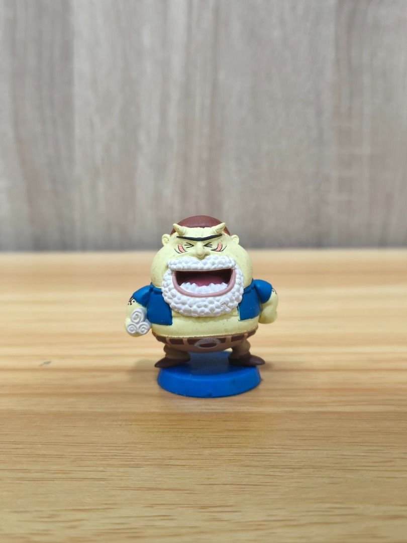 Tom MBH - One Piece Figure (Category: Figurines & Statues) located in Santa Rosa. Submitted by tinytoycrate (Listing ID 1464104468, Image 1). Description: - Chubby One Piece anime character figure - Wears a blue vest and brown pants - Stands on a blue display base - Small yet highly detailed - Ideal for collectors and One Piece fans - Please check photos for condition.