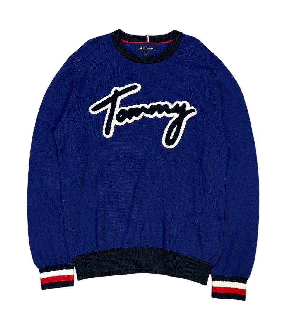 Tommy Hilfiger Blue Script Logo Sweater (Category: Coats, Jackets and Outerwear) located in Caloocan City. Submitted by mzcollection_349 (Listing ID 1463954211, Image 1). Description: - Blue Tommy Hilfiger sweater - White script logo - Ribbed cuffs and hem - Striped detail on cuffs - Crew neck - Ideal for casual wear.