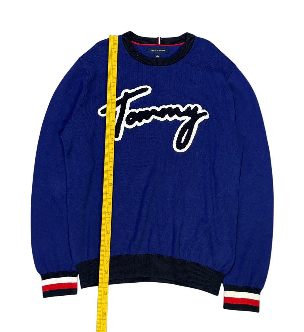 Tommy Hilfiger Blue Script Logo Sweater (Category: Coats, Jackets and Outerwear) located in Caloocan City. Submitted by mzcollection_349 (Listing ID 1463954211, Image 3). Description: - Blue Tommy Hilfiger sweater - White script logo - Ribbed cuffs and hem - Striped detail on cuffs - Crew neck - Ideal for casual wear.