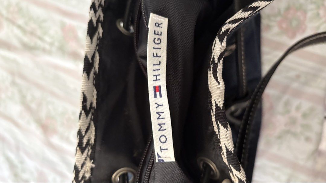 Tommy Hilfiger Denim Drawstring Bucket Bag (Category: Shoulder Bags) located in Manila. Submitted by tsukkisell (Listing ID 1463996265, Image 3). Description: - Cute Tommy Hilfiger denim bucket bag - Drawstring closure - Adjustable strap - Embroidered 'T.H.' monogram on front - Black interior with zippered pocket - Comes with original tags attached OP: $49 from the US.