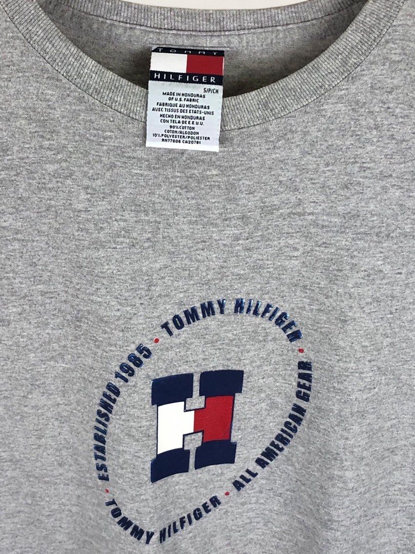 Tommy Hilfiger Grey T-Shirt (Category: Tshirts & Polo Shirts ) located in Manila. Submitted by 12essentials (Listing ID 1464029698, Image 3). Description: 📌 Excellent Condition 📌 S on tag fits M 📌 Length 28’ Width 20.5’ Grey Tommy Hilfiger t-shirt. Features the classic Tommy Hilfiger logo graphic on the front. Established 1985, All American Gear. Made from a cotton-polyester blend. Size S/P..