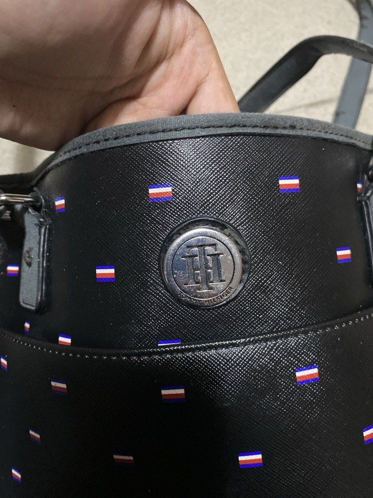 Tommy Hilfiger Tote Bag (Category: Tote Bags) located in Dagupan City. Submitted by maryennie (Listing ID 1463999483, Image 2). Description: Working zippers (all) Spacious interior Structured design Suitable for work, daily use or travel -Condition: Pre-loved, with visible signs of use . Please refer to photos for exact condition. ⭐️Selling as-is. Please inspect photos carefully before purchasing..