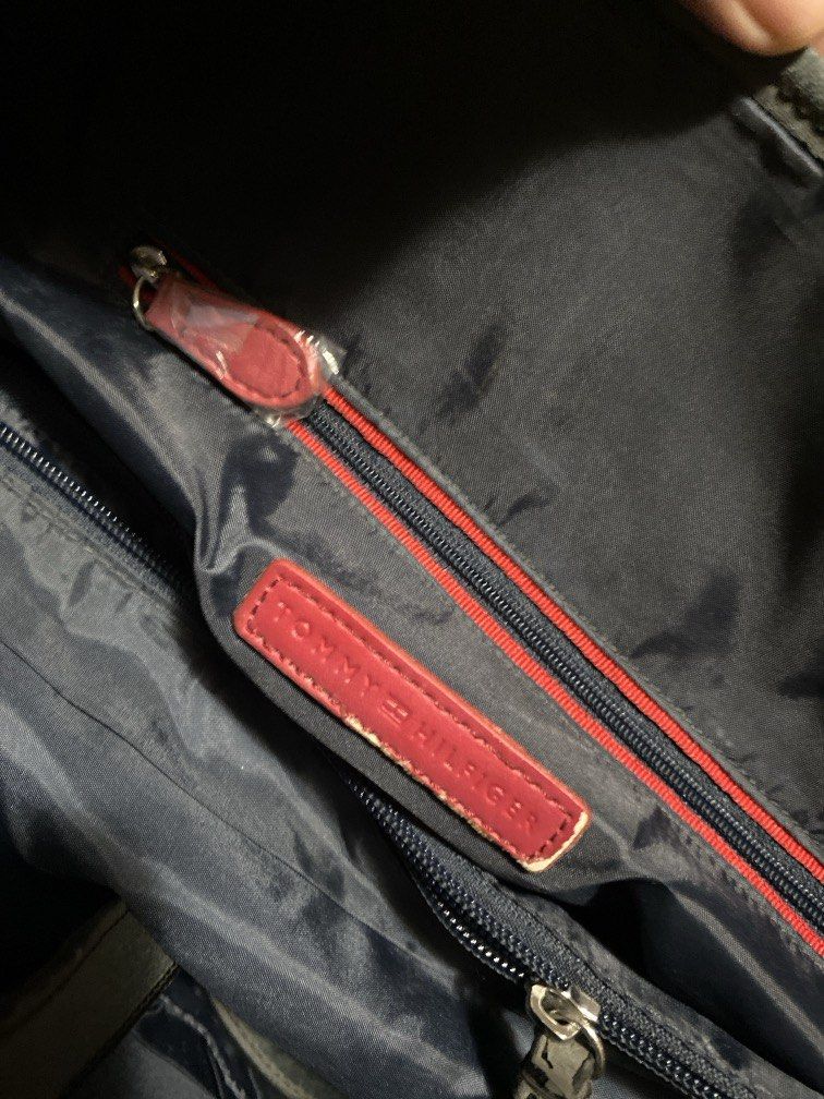 Tommy Hilfiger Tote Bag (Category: Tote Bags) located in Dagupan City. Submitted by maryennie (Listing ID 1463999483, Image 3). Description: Working zippers (all) Spacious interior Structured design Suitable for work, daily use or travel -Condition: Pre-loved, with visible signs of use . Please refer to photos for exact condition. ⭐️Selling as-is. Please inspect photos carefully before purchasing..