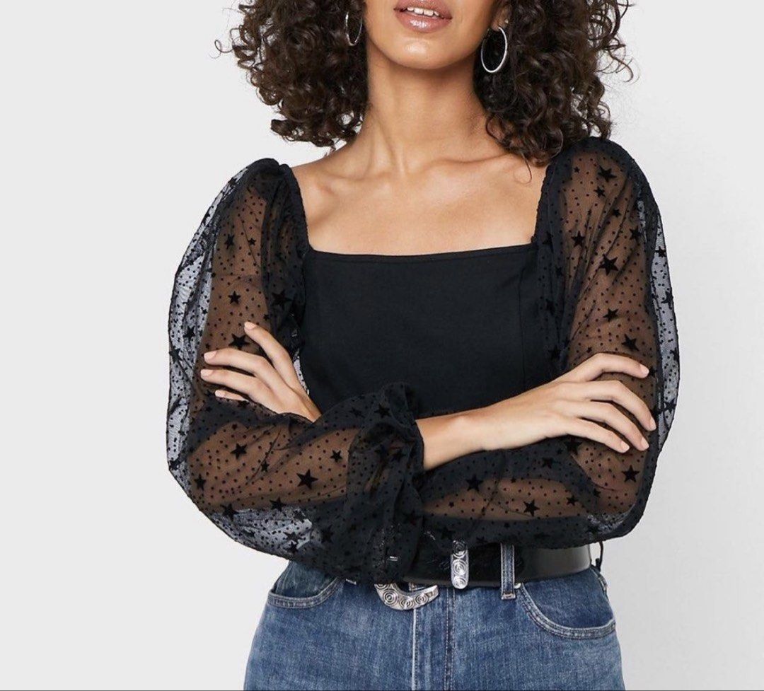 Topshop Mesh Puff Black Crop Sleeve (Category: Longsleeves) located in Binan City. Submitted by myprelovedhaul (Listing ID 1463966924, Image 1). Description: The item in the selected region is a Topshop mesh top featuring sheer star-print puff sleeves and a square neckline. It is designed with a fitted bodice and voluminous statement sleeves adorned with flocked stars, making it a popular piece for evening wear, festivals, or casual outings paire