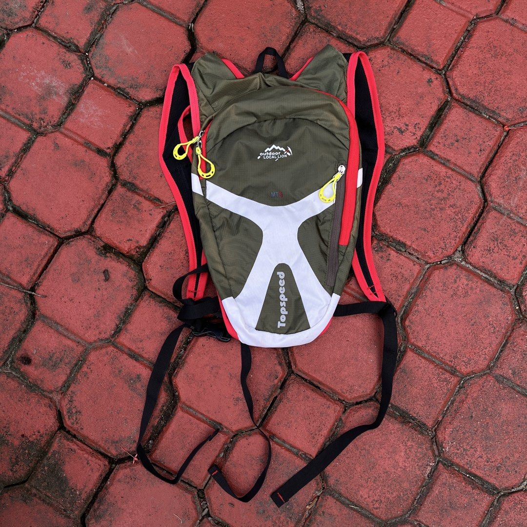TopSpeed Outdoor Performance MT5 Backpack (Category: Backpacks) located in Tarlac. Submitted by thriftspot2024 (Listing ID 1463994396, Image 1). Description: - Olive green backpack with white and red accents. - Lightweight and breathable mesh back panel for comfort. - Adjustable straps for a customized, comfortable fit. - Ideal for outdoor activities like hiking or cycling. - Features easy-to-grab yellow zipper pulls. - Ample space for all your e