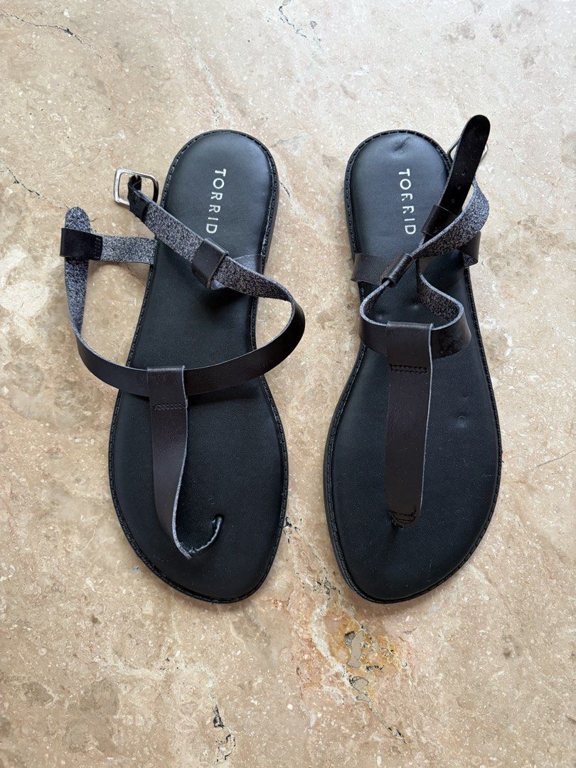 Torrid Black Leather Toe-Ring Crisscross Sandals (Category: Flats & Sandals) located in Quezon City. Submitted by tidyup.lara (Listing ID 1464134722, Image 1). Description: Sold as is Size 12 Condition 8/10: used but in good condition.