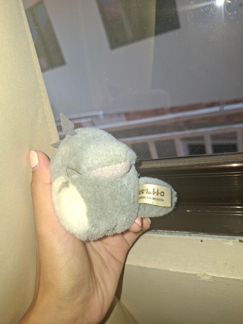 Totoro Plush in a House Bed (Category: Plushies & Soft Toys) located in Cebu City. Submitted by __sen (Listing ID 1463982617, Image 3). Description: - Adorable totoro plush peeking out from its charming little house. - House features a green, mossy roof and a wooden 'HOUSE' sign. - Plush toy is soft and features a grey and white color scheme. - Ideal for home decoration or as a cute collectible item. - Totoro tag is Sun Arrow - Comes with origina