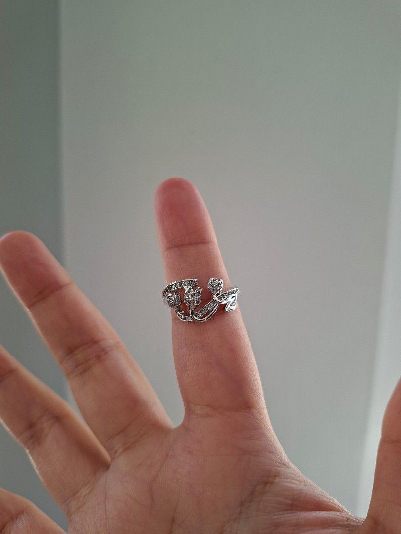 Tulips Flower Cubic Zirconia Stone Adjustable Ring Silver (Category: Rings) located in Dasmarinas. Submitted by danabrie22 (Listing ID 1463991476, Image 1). Description: adjustable size 5 - 9 very well-made, excellent crafstmanship 10/10 condition brand new stainless steel & white crystal-colored cubic zirconia stones made in Hongkong.
