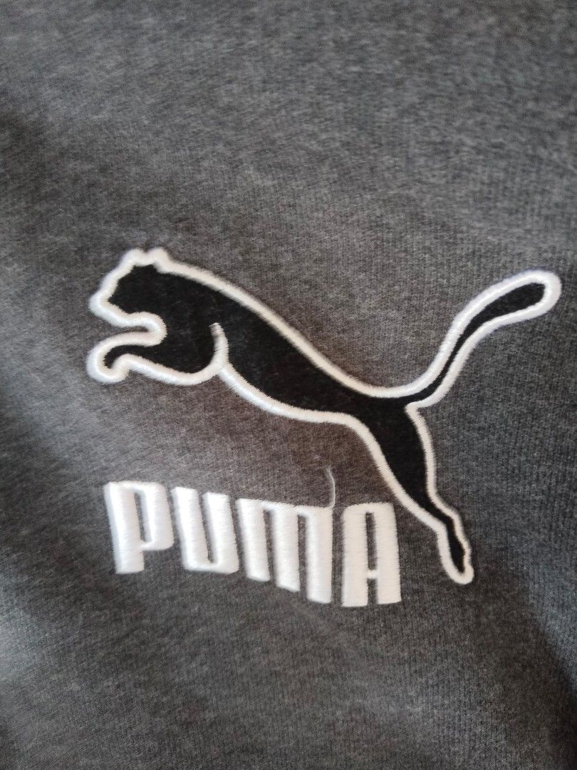Uma Hooded Varsity Jacket (Category: Coats, Jackets and Outerwear) located in Mabalacat. Submitted by al_amin_thrift (Listing ID 1463973880, Image 2). Description: ⚫ PUMA Varsity Hooded Jacket — Size M ✅ Brand: PUMA — Sport Lifestyle ✅ Size: M (US / UK M, EU 48/50) ✅ Color: Charcoal Grey Body + Black Sleeves + White Striped Ribbing ✅ Materials: - Body: 65% Cotton / 35% Polyester fleece — soft & warm ​ - Sleeves: Wool-blend — premium varsity style