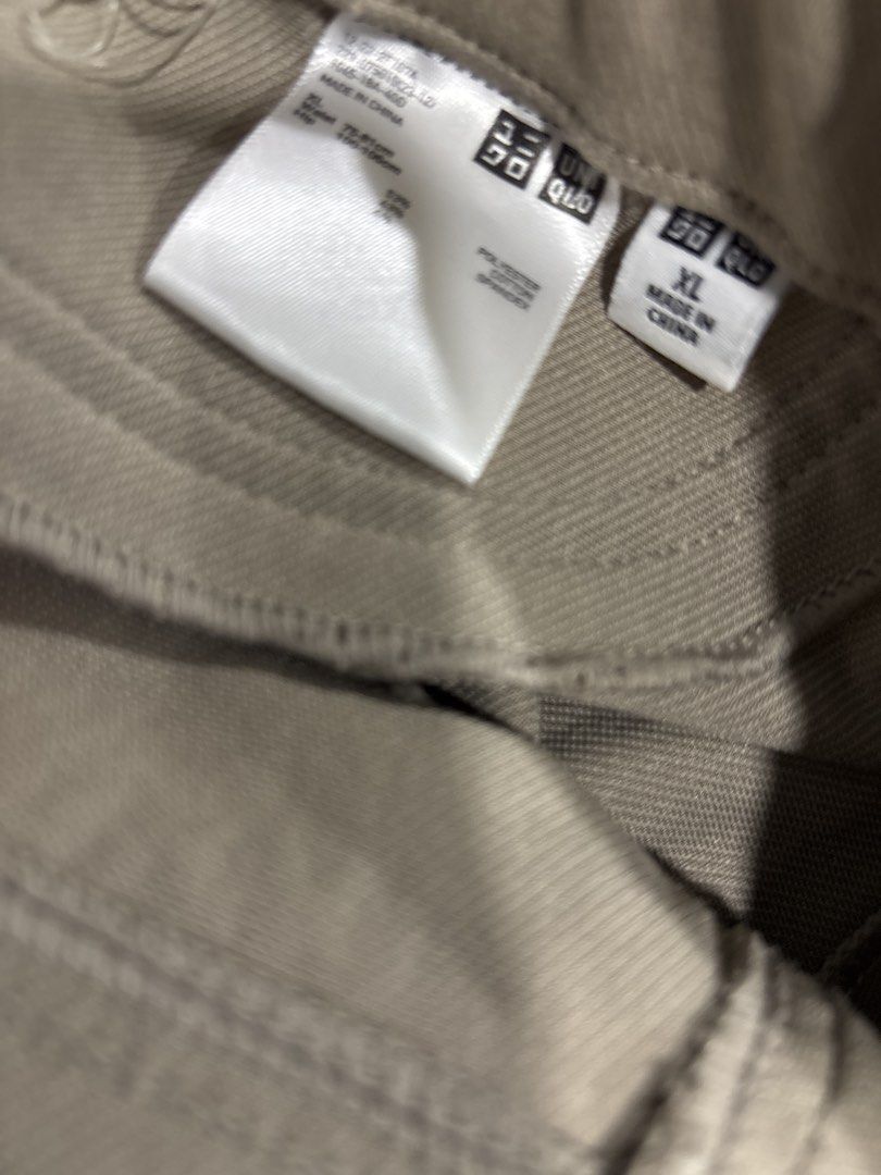 Uniqlo Beige Stretch Pants XL (Category: Jeans) located in Mandaluyong City. Submitted by clothescarousel (Listing ID 1464098388, Image 3). Description: - Uniqlo Beige Pants - Size: XL - Material: Comfortable stretch fabric - Features: Elastic waistband, two back pockets - Fit: Straight leg cut - Occasion: Ideal for casual wear.