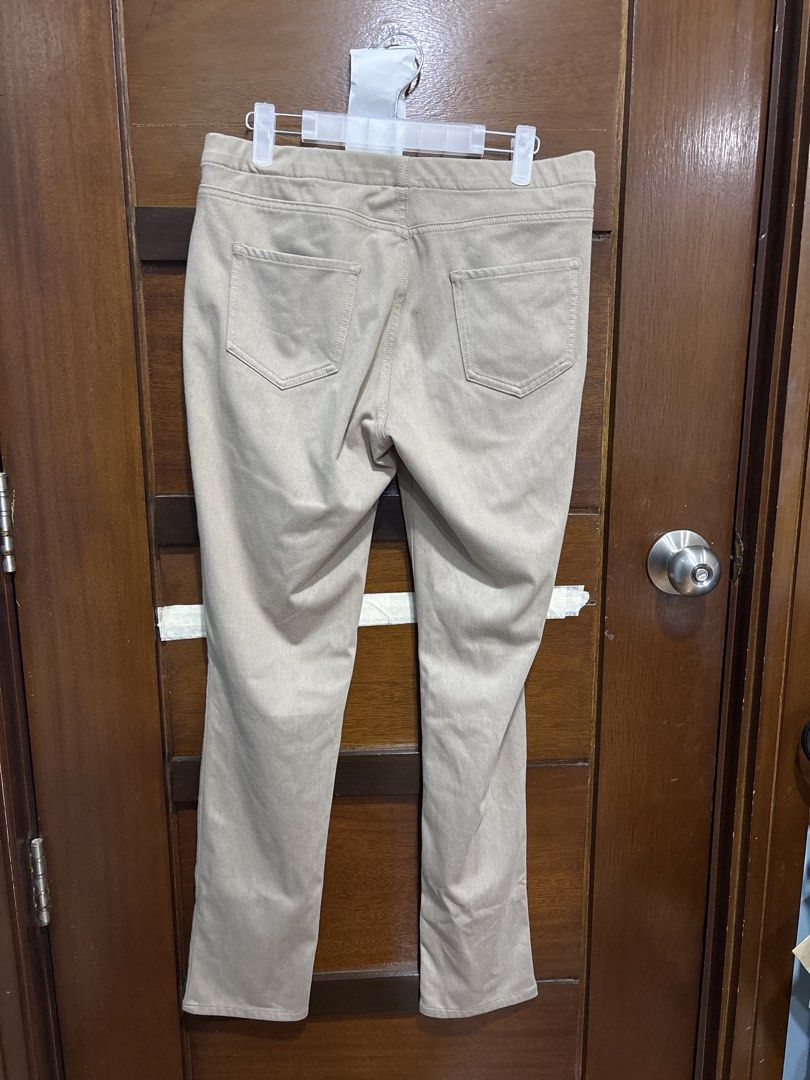 Uniqlo Beige Stretch Pants XL (Category: Jeans) located in Mandaluyong City. Submitted by clothescarousel (Listing ID 1464098388, Image 2). Description: - Uniqlo Beige Pants - Size: XL - Material: Comfortable stretch fabric - Features: Elastic waistband, two back pockets - Fit: Straight leg cut - Occasion: Ideal for casual wear.