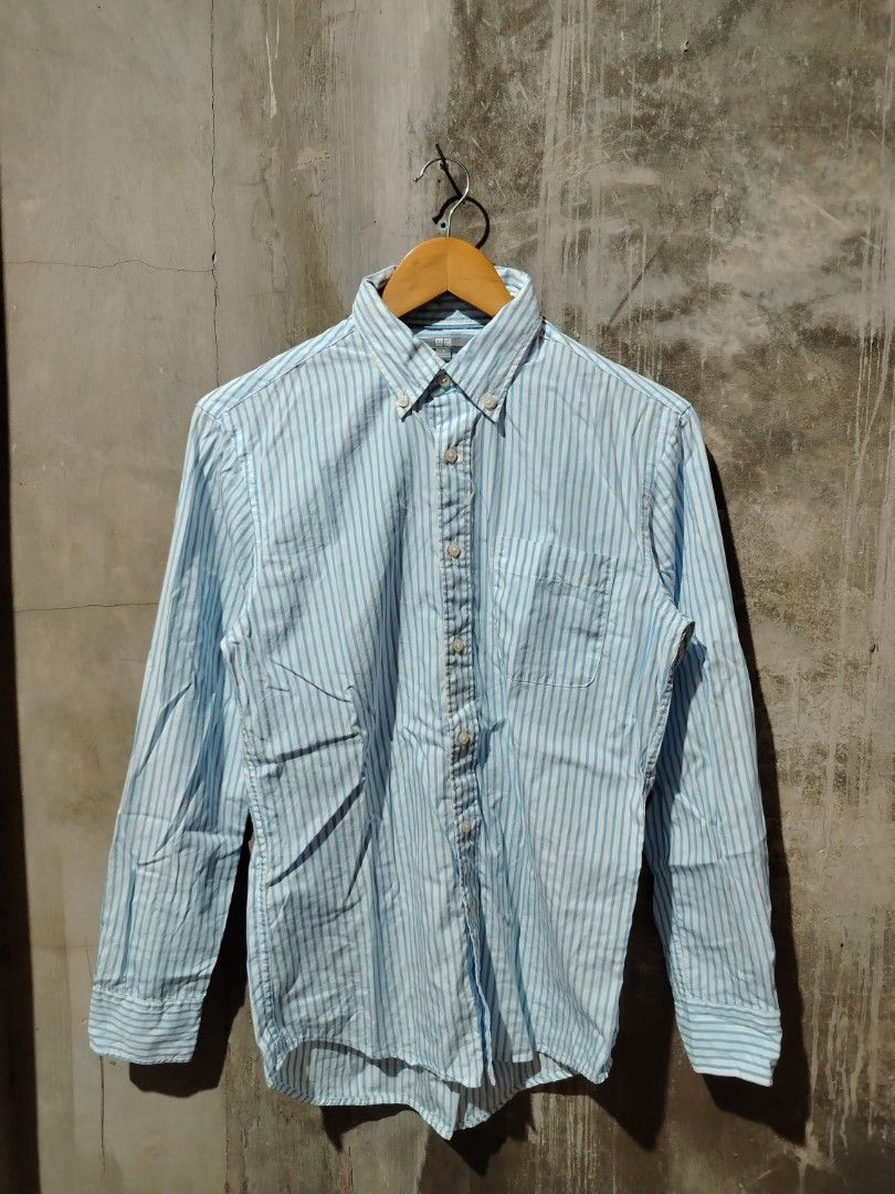 Uniqlo Blue Striped Button-Up Shirt (Category: Tshirts & Polo Shirts ) located in Tagum. Submitted by kotasallys40096 (Listing ID 1464108224, Image 1). Description: - Uniqlo Button-Up Shirt - 19*26 - Color: Light Blue & White Stripes - Collar: Classic Button-Down - Features: Chest Pocket - Material: 100% Cotton - Size: S - Style: Versatile for casual or smart-casual occasions.