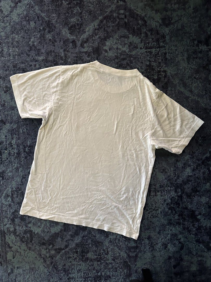 Uniqlo Basquiat Shirt (Category: Shirts) located in Makati City. Submitted by smolpapi (Listing ID 1464135009, Image 3). Description: Uniqlo UT x Jean-Michel Basquiat Graphic T-Shirt.