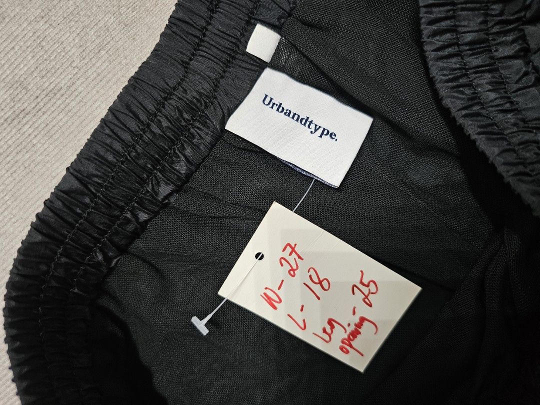 Urbandtype Black Shorts (Category: Shorts) located in Baguio. Submitted by kayeonlineshop (Listing ID 1463998162, Image 2). Description: black nylon shorts featuring an elastic drawstring waistband and a small woven logo tag near the hem w27-30 L18 h25.