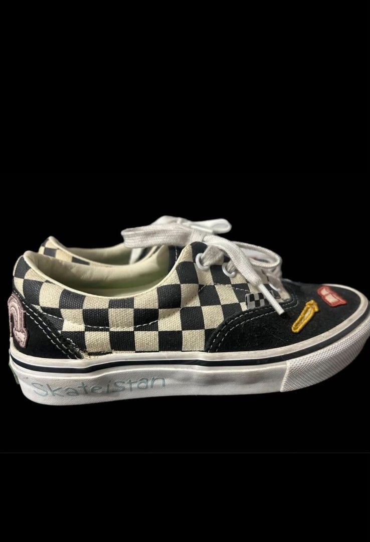 Van's shoes (Category: Casual Shoes) located in Manila. Submitted by rubymielbona (Listing ID 1464021401, Image 2). Description: - Brand: Vans - Model: Era (Checkerboard with Patches) - Design: Classic checkerboard pattern with embroidered patches (rose, sun, rainbow, etc.) - Color: Black, White, and multicolor patches - Size: US Men's 3.5 / UK 2.5 / EUR 34.5 / CM 21.5 - Features: Iconic Vans waffle sole, lace-up closure Vans limited edition 1200