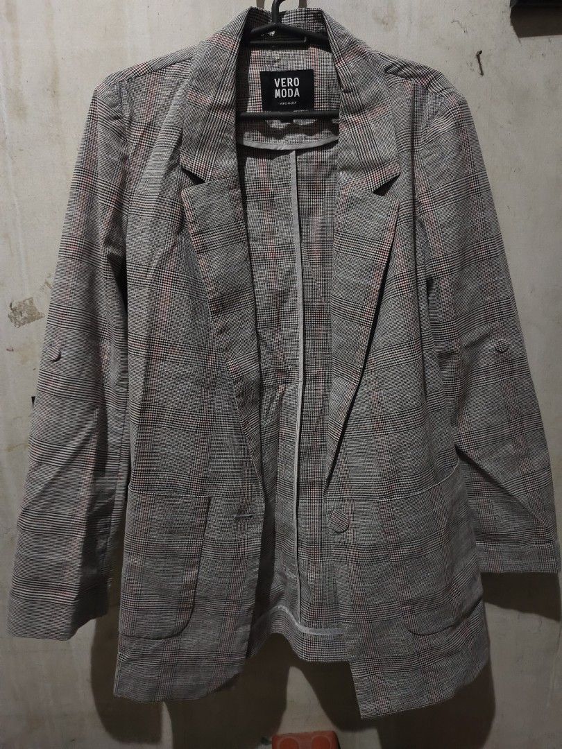 VERO MODA Plaid Blazer Jacket (Category: Coats, Jackets and Outerwear) located in Quezon City. Submitted by justdump_a (Listing ID 1464050877, Image 1). Description: - Vero Moda classic plaid blazer - Features red and blue accents - Two-button front closure - Functional pockets - Button detail on sleeve cuffs - Versatile for layering over tops or dresses - Creates a sharp, polished look.
