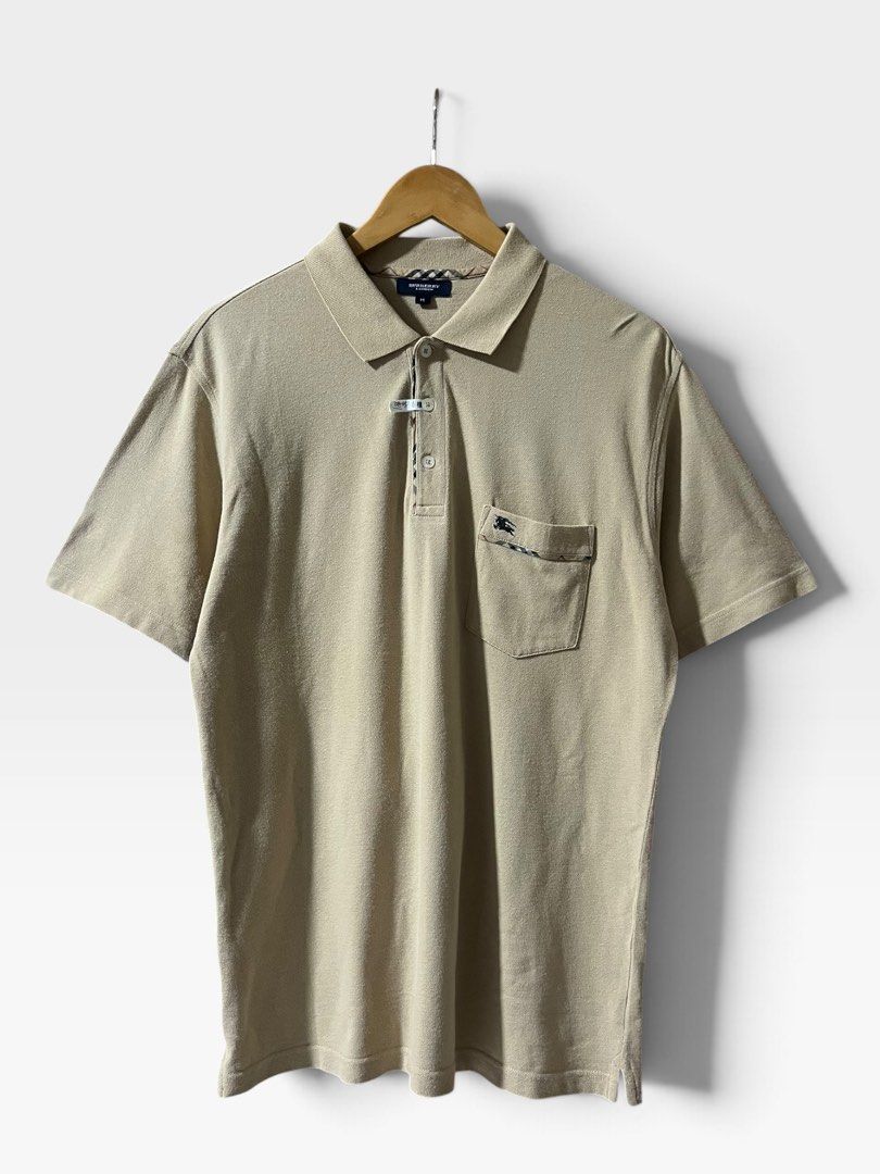 Burberry 2000s Nova Check Trim Polo Shirt (Category: Tshirts & Polo Shirts ) located in Tagum. Submitted by graveyard_archive.ph (Listing ID 1464058047, Image 1). Description: M on tag pasok L 21x29.5 Very Good Condition Cr: 9/10 Lints, minimal white line on underarm (not obvious) Burberry 2000s Nova Check Trim Polo Shirt This piece is a classic short-sleeve pique polo shirt from Burberry London, produced in the early to mid-2000s following the b