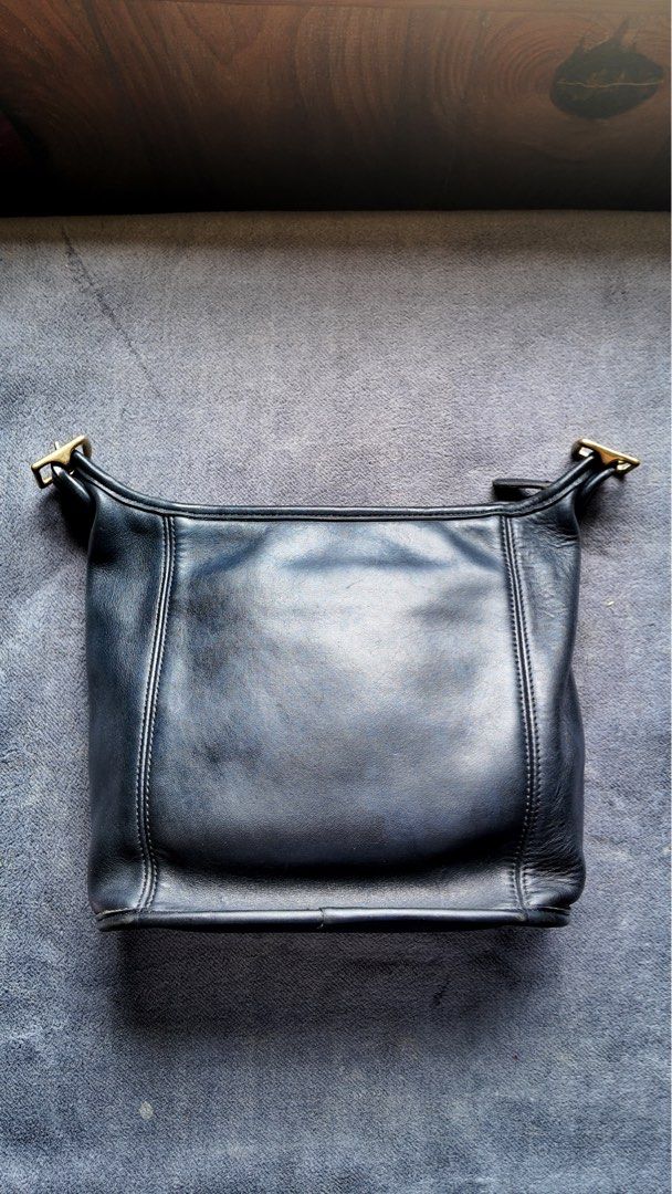 Vintage Coach (Category: Cross-body Bags) located in Baguio. Submitted by chickenhand (Listing ID 1464057671, Image 1). Description: Vintage Coach - medium duffle slim - basic interior cleaning and leather conditioning - has some corner fading - no hangtag - check photos for other details.