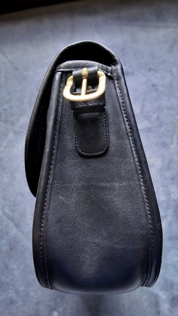 Vintage Coach Saddlery NYC (Category: Cross-body Bags) located in Baguio. Submitted by chickenhand (Listing ID 1464056959, Image 3). Description: Coach Saddlery Black in brass hardware - 8 X 9.75 X 3.25 inches - medium sized sling/cross-body bag - Creed number: 261 - 0748 - Style number: 9535 - Upon inspection, bag has been through a repair. Different zipper hardware and few different sized threads but barely noticeable. - a tiny chip on the stra