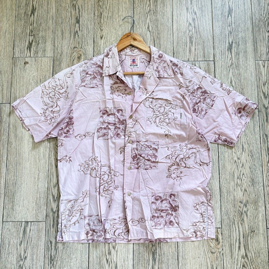 Vintage Pink Buttondown Polo (Category: Formal Shirts) located in Imus. Submitted by reloved.nd (Listing ID 1464074352, Image 1). Description: - Cool pink short-sleeved shirt - Unique dragon print - Classic button-up front with collar - Two chest pockets - Ideal for casual, stylish outfits - Pairs well with shorts or jeans - Great for warmer weather.