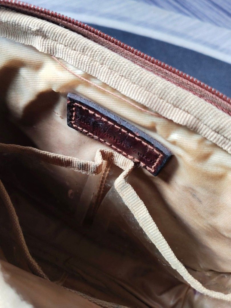 VINTAGE Polo Ralph Lauren Monogram Pouch (Category: Luxury Bags & Wallets) located in Manila. Submitted by icamalicdem29 (Listing ID 1462183650, Image 2). Description: - Classic Polo Ralph Lauren pouch VINTAGE - Signature monogram pattern - Brown and tan plaid design with leather trim - Zipper closure - Interior with clear compartments for organization - Ideal for makeup or travel essentials - Compact size.