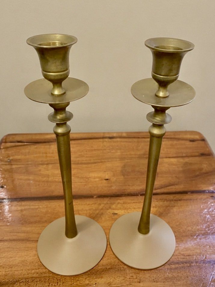Vintage Solid Brass Taper Candlestick holders in Pair (Category: Vintage Collectibles) located in Nagcarlan. Submitted by snccollection (Listing ID 1463991455, Image 2). Description: These are a pair of vintage solid brass taper candlestick holders, featuring long slender stems, flared round bases, and decorative knopped detailing with drip pans just below the candle cups. (10 inches in height) .