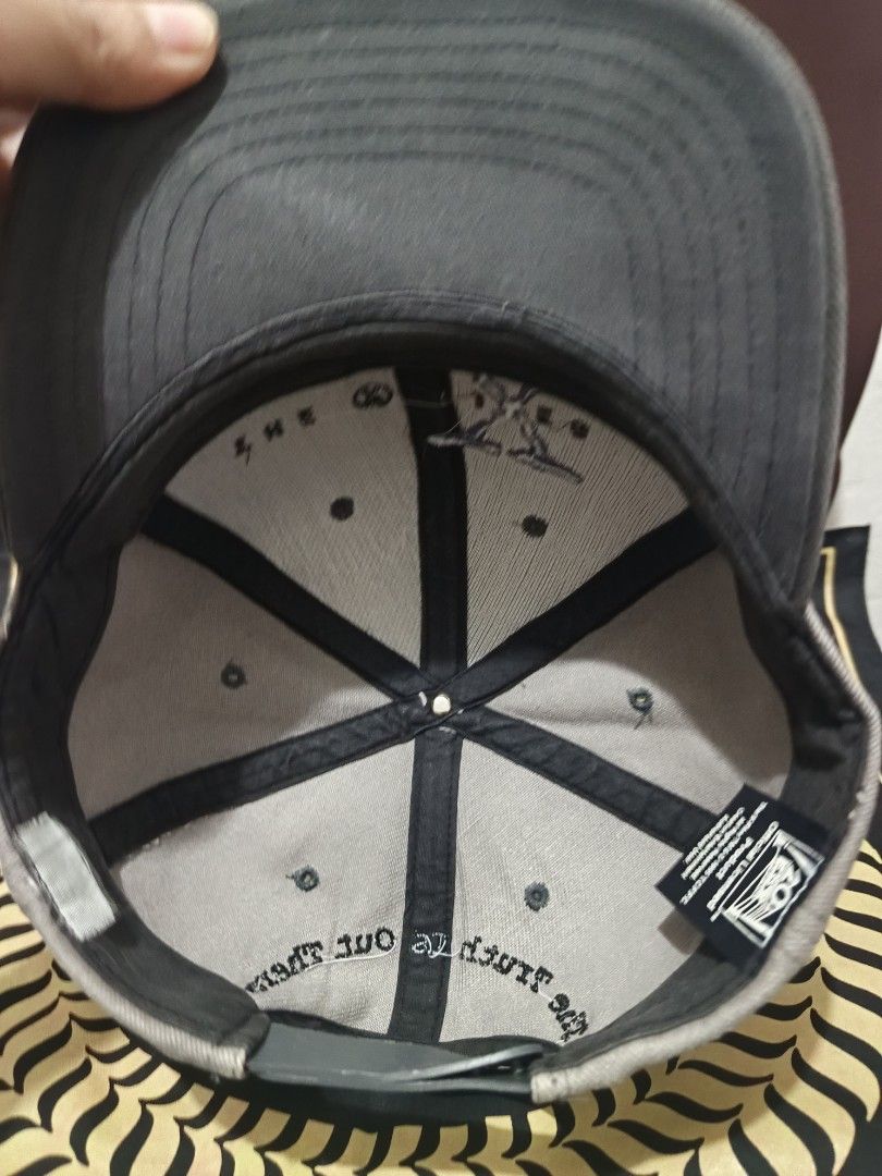 Vintage The X-Files Embroidered Baseball Cap (Category: Caps & Hats) located in Jaen. Submitted by ratbunizer (Listing ID 1463900156, Image 3). Description: - Grey and dark green baseball cap - Embroidered 'The X-Files' logo on the front - Adjustable strap for a comfortable fit - Perfect for X-Files fans.