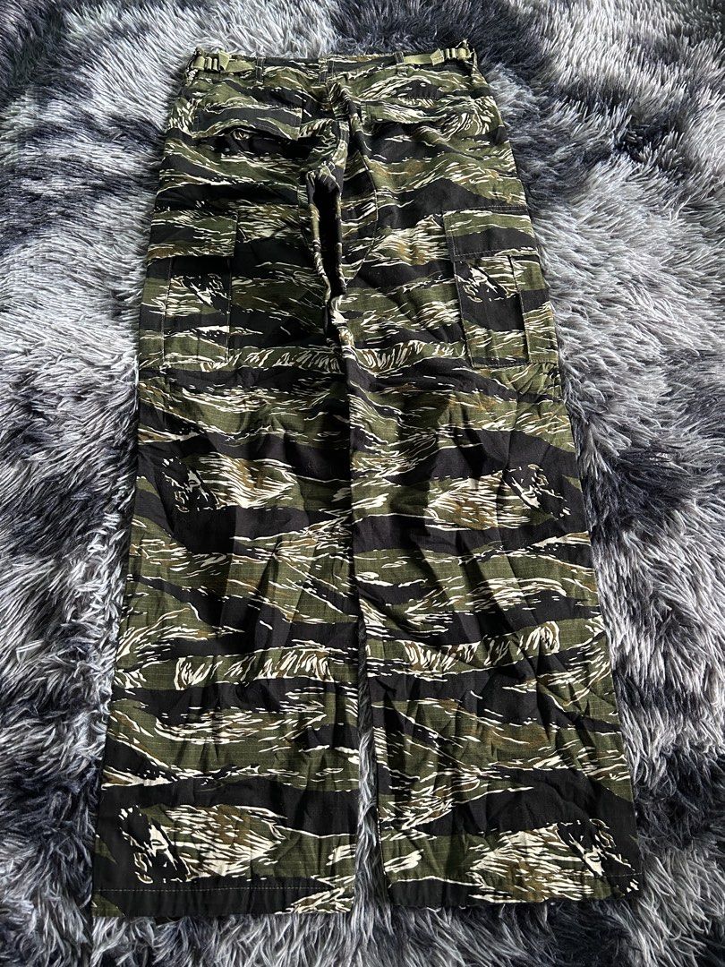 Vintage Tiger Camouflage Utility Cargo Pants (Category: Jeans) located in Baao. Submitted by prettysixtythrift_17 (Listing ID 1464021939, Image 2). Description: ▪️Waistline: 30 adjustable buckle ▪️Length: 40 ▪️Hem: 9 ▪️Hips: 17 ▪️Leg Thigh: 13 ▪️Rise: 11 ▪️Inseam: 30.