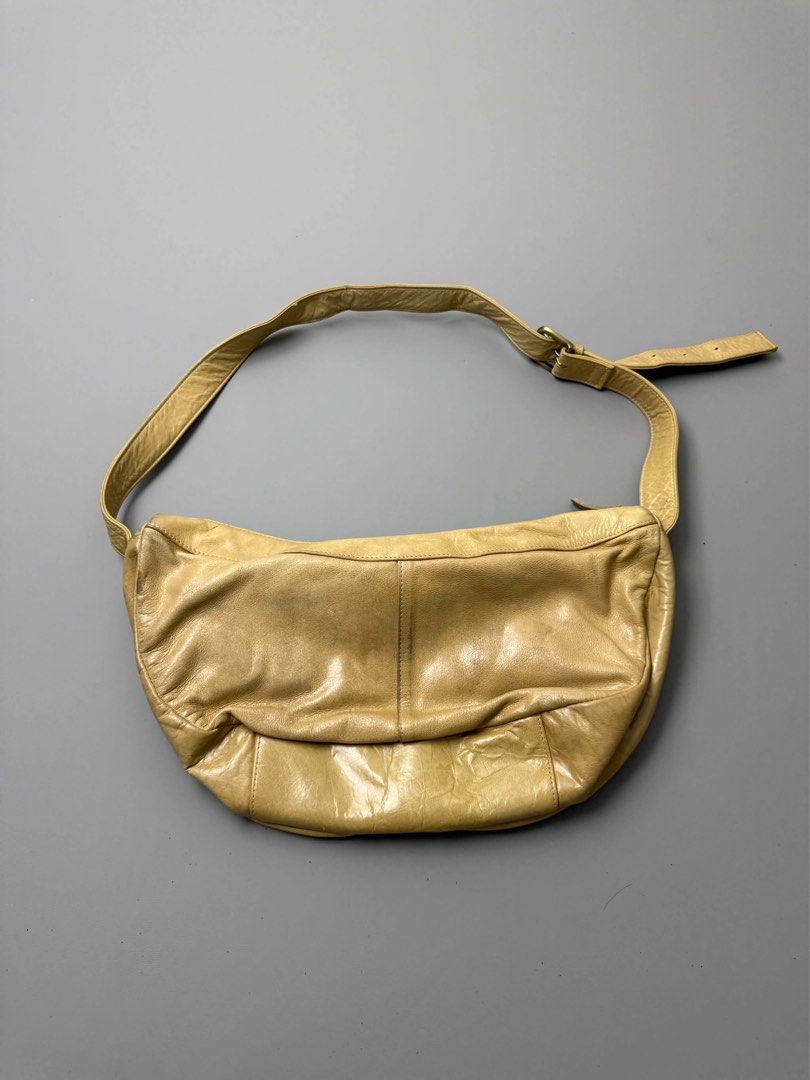 VINTAGE TSUMORI CHISATO (Category: Shoulder Bags) located in Guagua. Submitted by sweetboyy (Listing ID 1464054835, Image 2). Description: VINTAGE TSUMORI CHISATO CREAM/TAN LEATHER CRESCENT HOBO BAG.