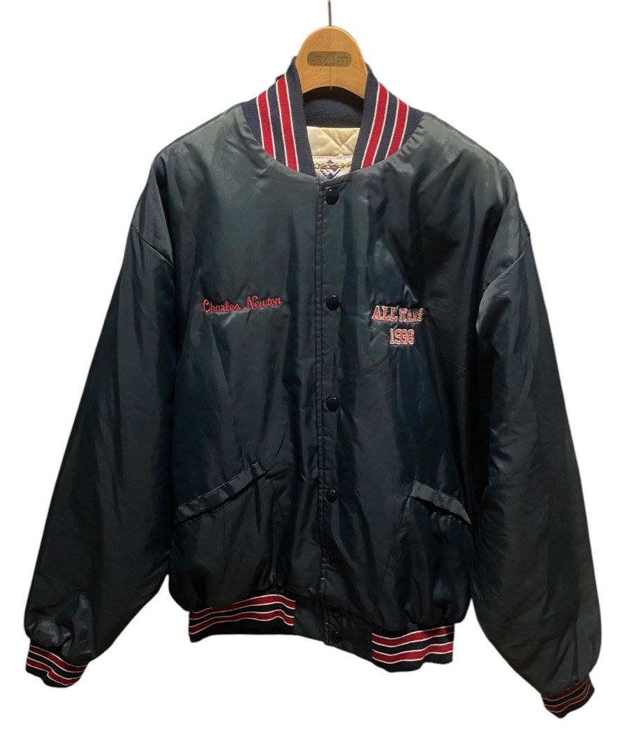 Vintage Windless All Stars 1998 Bomber Jacket (Category: Coats, Jackets and Outerwear) located in San Pedro. Submitted by lifebeginsaftercoff33 (Listing ID 1464065466, Image 2). Description: - Vintage Charles Newton bomber jacket - 'All Stars 1998' embroidered on front This is a vintage dark nylon snap-front bomber jacket featuring red and white striped ribbed trim and “ALL STARS 1998” chest embroidery. - 'Orinda' embroidered across the back - Qu