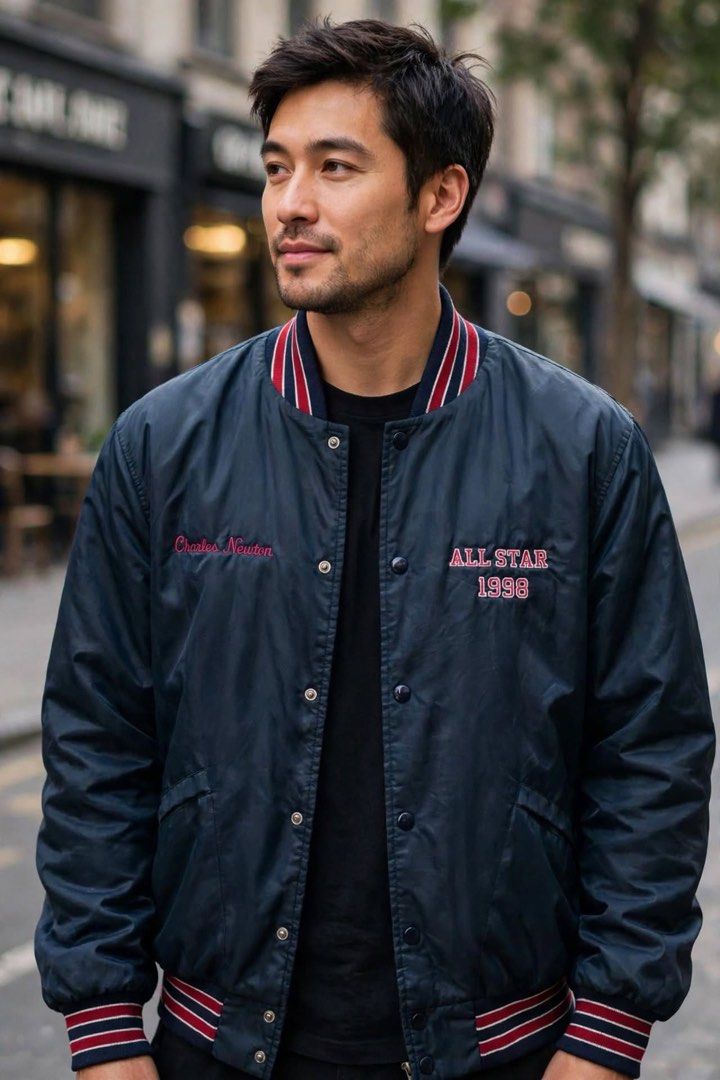 Vintage Windless All Stars 1998 Bomber Jacket (Category: Coats, Jackets and Outerwear) located in San Pedro. Submitted by lifebeginsaftercoff33 (Listing ID 1464065466, Image 1). Description: - Vintage Charles Newton bomber jacket - 'All Stars 1998' embroidered on front This is a vintage dark nylon snap-front bomber jacket featuring red and white striped ribbed trim and “ALL STARS 1998” chest embroidery. - 'Orinda' embroidered across the back - Qu