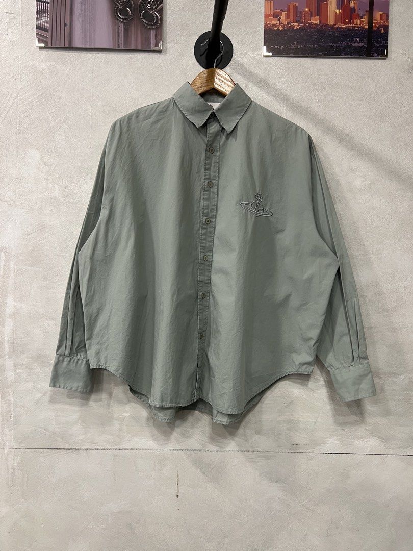 Vivienne Westwood Orb logo button down shirt (Category: Tshirts & Polo Shirts ) located in Manila. Submitted by -handpick- (Listing ID 1463940700, Image 3). Description: This is a sage green long-sleeve button-up shirt featuring an embroidered Vivienne Westwood Orb logo on the chest. tonal embroidered orb logo on the back. Size : Large Dimensions : Length : 27 Width : 28 Shoulder : 21 Sleeve : 22 Sign of wear in good condition .