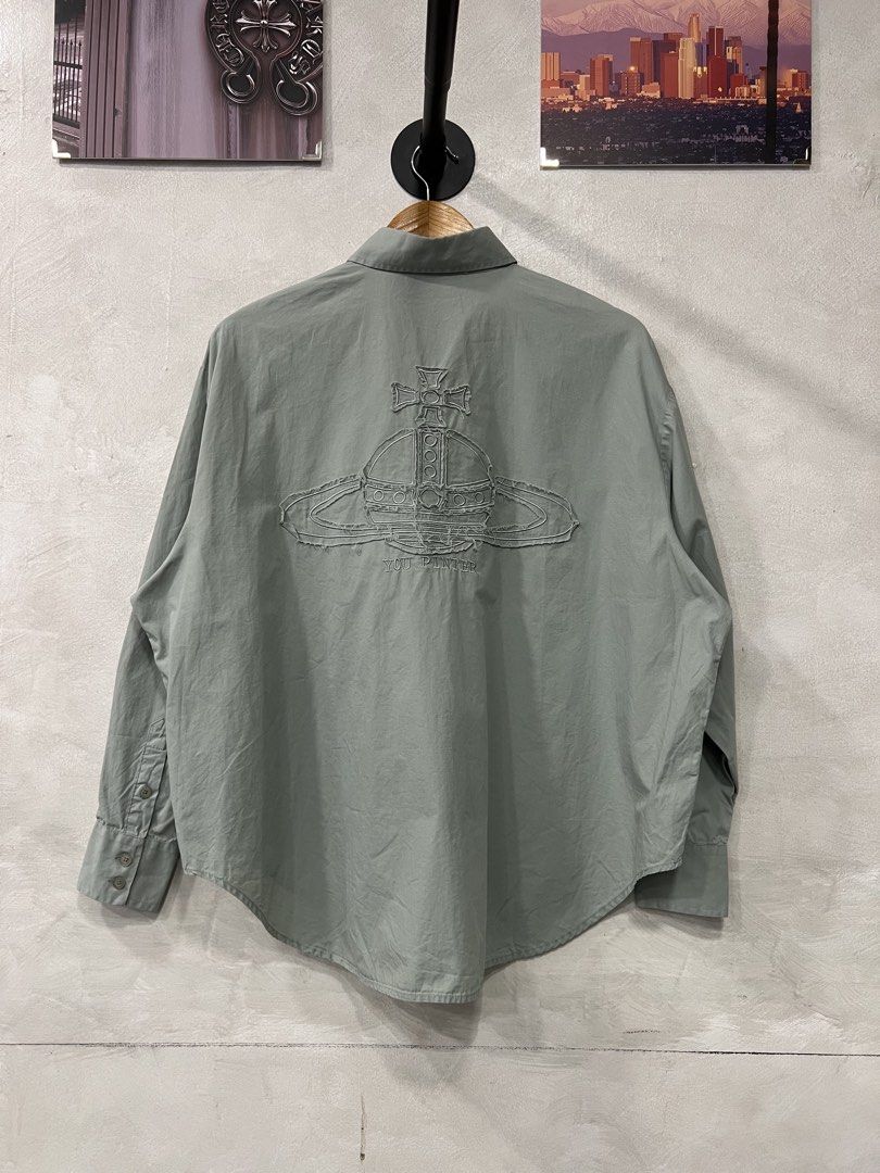 Vivienne Westwood Orb logo button down shirt (Category: Tshirts & Polo Shirts ) located in Manila. Submitted by -handpick- (Listing ID 1463940700, Image 1). Description: This is a sage green long-sleeve button-up shirt featuring an embroidered Vivienne Westwood Orb logo on the chest. tonal embroidered orb logo on the back. Size : Large Dimensions : Length : 27 Width : 28 Shoulder : 21 Sleeve : 22 Sign of wear in good condition .