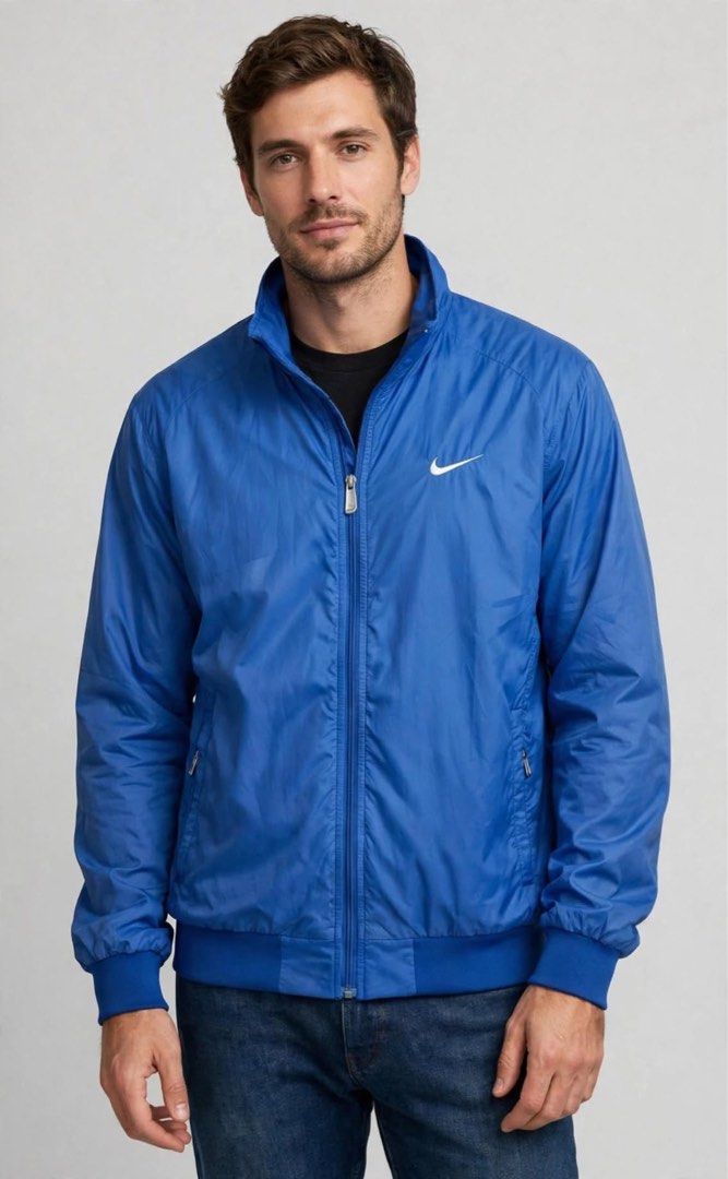 VTG Nike Blue Water Resistant Track Jacket (Category: Coats, Jackets and Outerwear) located in San Pedro. Submitted by lifebeginsaftercoff33 (Listing ID 1464047618, Image 1). Description: - Vintage Blue Nike water resistant track jacket - Can be unisex - Full zip closure - Classic Nike swoosh logo (Embroiderd) on chest - Logo on the back (Embroiderd) - Two zip front pockets & 1 inside pocket - Elasticated cuffs and hem - Ideal for casual wear or 