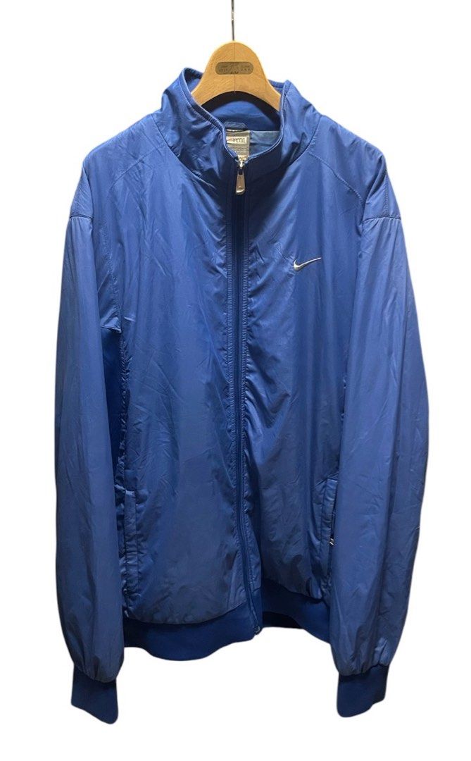 VTG Nike Blue Water Resistant Track Jacket (Category: Coats, Jackets and Outerwear) located in San Pedro. Submitted by lifebeginsaftercoff33 (Listing ID 1464047618, Image 3). Description: - Vintage Blue Nike water resistant track jacket - Can be unisex - Full zip closure - Classic Nike swoosh logo (Embroiderd) on chest - Logo on the back (Embroiderd) - Two zip front pockets & 1 inside pocket - Elasticated cuffs and hem - Ideal for casual wear or 