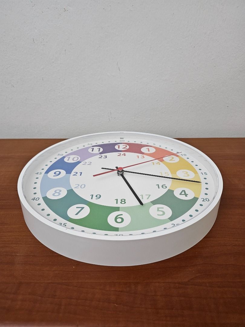 Wall Clock (Category: Educational & Learning Toys) located in Singapore. Submitted by brittanynormandy (Listing ID 1464032552, Image 3). Description: One Colourful Wall Clock selling at $15. The retail price for a similar wall clock is shown in Picture number 5. Description: • Clock Size: 275mm (Diameter) x 35mm (Depth) • Material: Sturdy plastic case. • Silent: Silent wall clock with very soft ticking second sound. • Battery Operated: - Wall clo