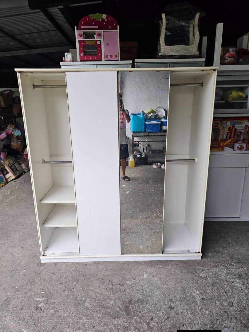 Wardrobe (Category: Shelves, Cabinets & Racks) located in Meycauayan. Submitted by marygracecasimiro (Listing ID 1464092238, Image 3). Description: ‼️‼️SALE NA‼️‼️ Wardrobe Cabinet‼️ ✔L-63 H-71 W-22.5 inches 📏 ✔4 Sliding Doors & 2 Shelves🗄 ✔Laminated 🔖 ✔️Compress & Plywood Back! 💢 ✔Scratches As-is! 👌🩷🧡.