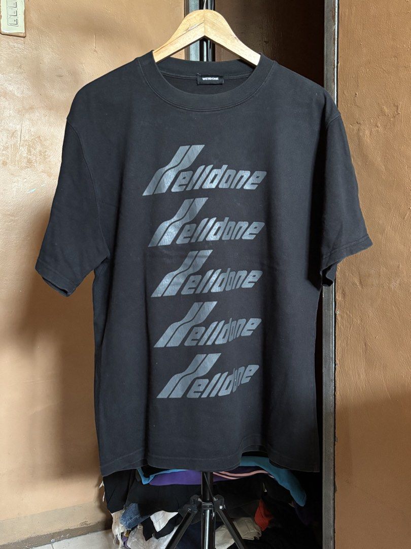 WE11DONE Black T-shirt with Repeat Logo Print (Category: Tshirts & Polo Shirts ) located in Manila. Submitted by manifest_05 (Listing ID 1463948714, Image 1). Description: - WE11DONE black short-sleeved t-shirt - Repeated grey logo graphic on front - Crew neck style.