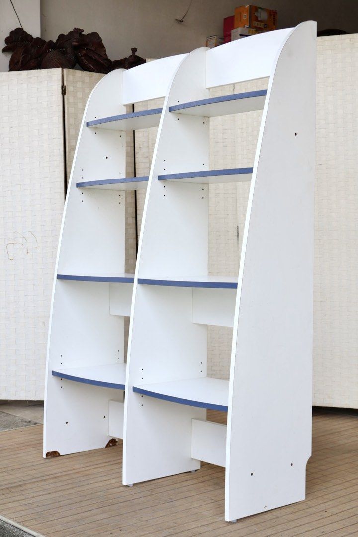 White and Blue 2-Tier Bookshelf Display Shelf (Category: Shelves, Cabinets & Racks) located in Bulacan. Submitted by FurnitureGallery (Listing ID 1463996604, Image 3). Description: - White bookshelf with stylish blue shelf accents - Two separate units, can be placed together or separately - Each unit features four spacious shelves - Perfect for organizing books, displaying decor, and more - Dimensions: Approx. [insert height] tall x [insert width